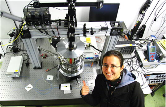 This is Döndü's experimental setup from her PhD. The shiny metal in the middle is the cryostat in which she did experiments using superconducting detectors. Inside the cryostat temperatures drop as low as -271 ◦C.
