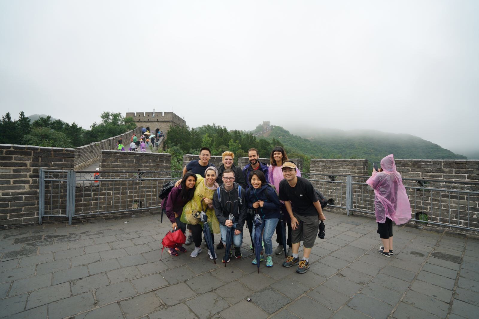 A group of postgraduate researchers on the Great Wall of China.